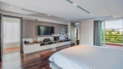 Spacious bedroom with large window and balcony access