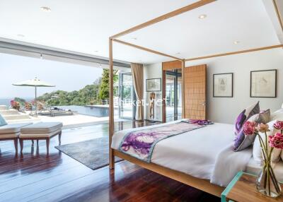 Bright and spacious bedroom with pool view