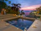 Beautiful outdoor area featuring a small pool with a view of the ocean at sunset