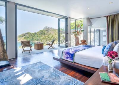 Spacious bedroom with ocean view and modern decor