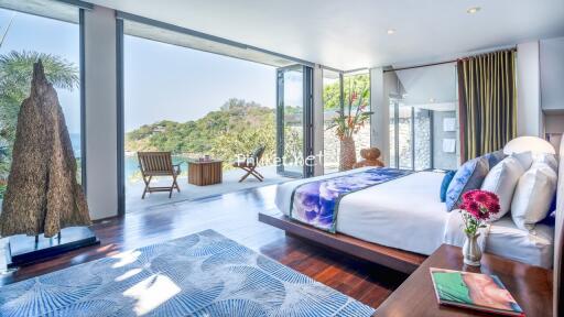 Spacious bedroom with ocean view and modern decor