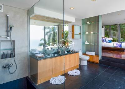 Modern bathroom with glass shower and ocean view