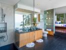 Modern bathroom with glass shower and ocean view