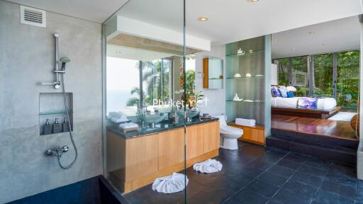 Modern bathroom with glass shower and ocean view