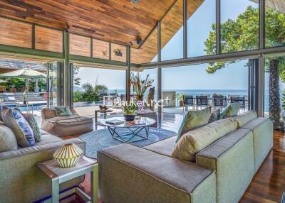 Spacious living area with large windows and outdoor view