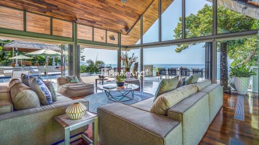 Spacious living area with large windows and outdoor view