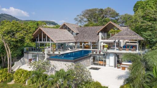 Spacious luxury villa with outdoor pool and tropical surroundings