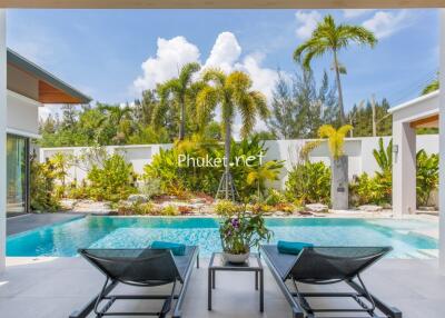 Outdoor living area with pool and garden view