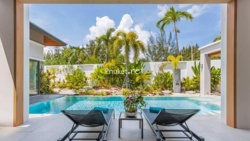 Outdoor living area with pool and garden view