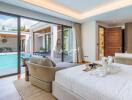 Luxurious bedroom with pool view and modern decor