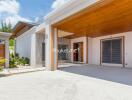 Modern exterior of a home with wooden accents and open garage