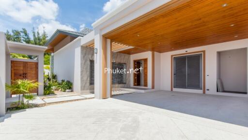 Modern exterior of a home with wooden accents and open garage