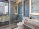 Modern bathroom with glass shower, large mirror, and sink basin