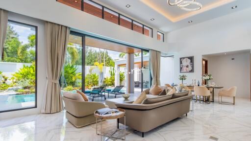 Spacious living room with pool view