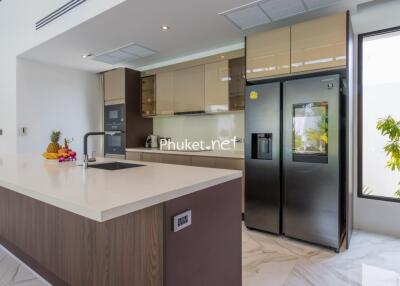 Modern kitchen with island and stainless steel appliances