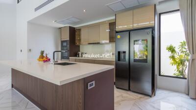 Modern kitchen with island and stainless steel appliances