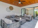 Stylish outdoor living area with comfortable seating and ceiling fan