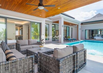 Outdoor living area with pool and seating