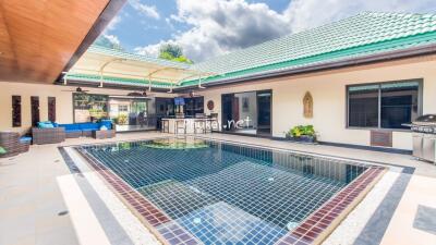 Outdoor area with swimming pool and patio seating