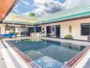 Outdoor area with swimming pool and patio seating