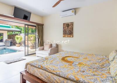 Spacious bedroom with pool view