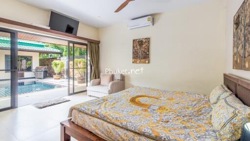 Spacious bedroom with pool view