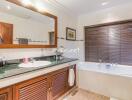 Modern bathroom with large mirror and bathtub