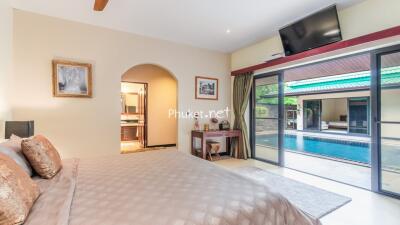 Spacious bedroom with pool view