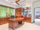 Well-lit home office with wooden furniture and shelving