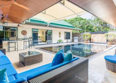 Outdoor patio with pool and seating area