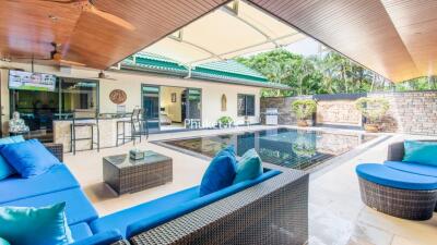 Outdoor patio with pool and seating area