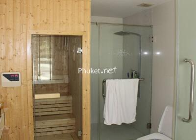 Modern bathroom with a sauna and glass shower