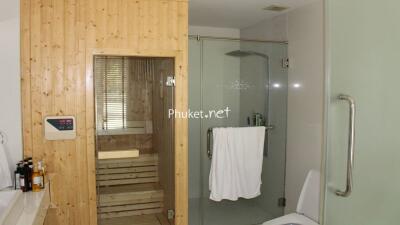 Modern bathroom with a sauna and glass shower