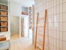 Modern bathroom with storage units and ladder rack