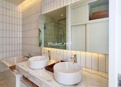 Modern bathroom with double sink and large wall mirror