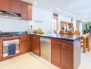 Modern kitchen with wooden cabinetry and dining area