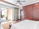 Spacious modern bedroom with large wardrobe and balcony access