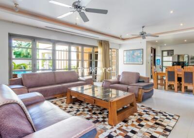 Spacious living room with modern furniture and large windows