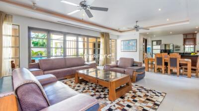 Spacious living room with modern furniture and large windows