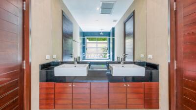 Modern bathroom with double sinks and large mirror