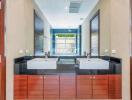 Modern bathroom with double sinks and large mirror