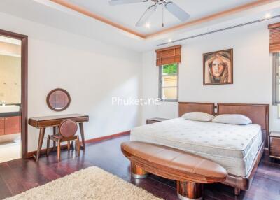 Spacious bedroom with furniture and decor