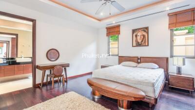 Spacious bedroom with furniture and decor