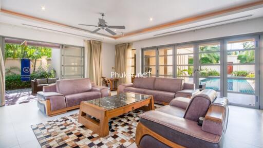 Spacious and modern living room with pool view