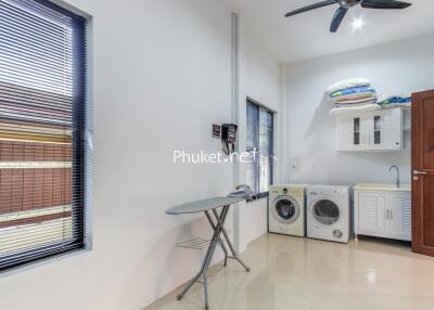 Spacious laundry room with modern appliances
