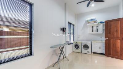 Spacious laundry room with modern appliances