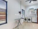 Spacious laundry room with modern appliances