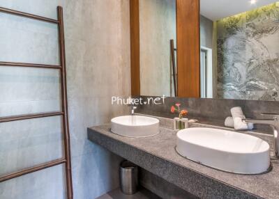 Modern bathroom with twin sinks and large mirror