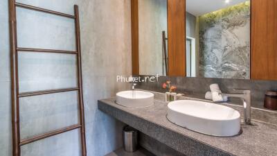 Modern bathroom with twin sinks and large mirror