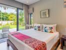 Modern bedroom with a view of the garden and pool